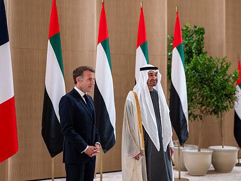 Sheikh Mohamed bin Zayed Al Nahyan receives Emmanuel Macron during an official visit reception at the airport.
