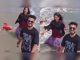 A viral beach video appears to show a toddler struggling in incoming waves while two adults film themselves nearby. A bystander rushes to the child's aid and pulls the toddler away from the water. The footage has sparked debate online over child safety and parental supervision.