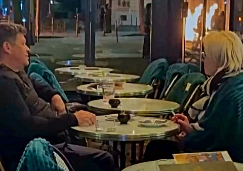 'Nothing stops them having a drink': Paris couple’s calm amid protest fires goes viral