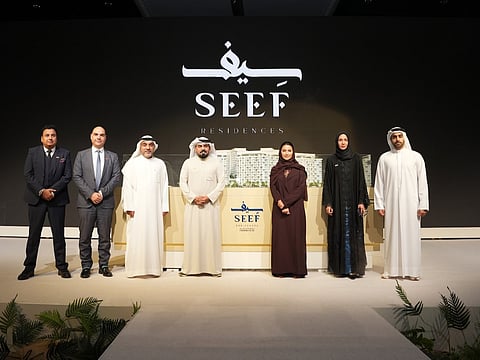 A group photo for Raed Kajoor Al Nuaimi, CEO of Alef Group; Hussain Al Mahmoudi, CEO of Sharjah Research, Technology and Innovation Park (SRTIP); and Eng. Nada Taryam, Board Member of Alef Group during the launch of Seef Residences.