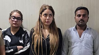 Shraddha Dubey (centre) with her sister and driver following their arrest in Nagpur.