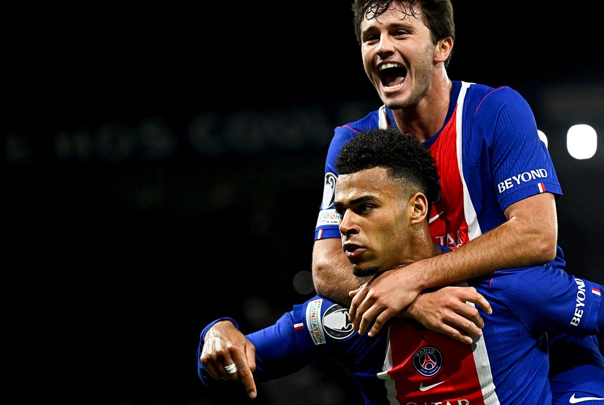 PSG's French forward #14 Desire Doue (L) celebrates with teammate PSG's Portuguese midfielder #87 Joao Neves after scoring his team's first goal during the UEFA Champions League first round day 3 football match between Paris Saint-Germain (PSG) and FC Barcelona at the Parc de Princes stadium in Paris on October 20, 2026.