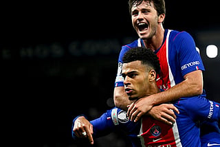 PSG's French forward #14 Desire Doue (L) celebrates with teammate PSG's Portuguese midfielder #87 Joao Neves after scoring his team's first goal during the UEFA Champions League first round day 3 football match between Paris Saint-Germain (PSG) and FC Barcelona at the Parc de Princes stadium in Paris on October 20, 2026.