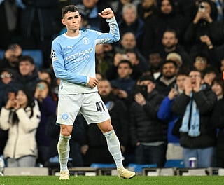 Manchester City's English midfielder #47 Phil Foden celebrates scoring the team's fifth goal, his hat trick during the UEFA Champions League football match between Manchester City and AEK Athens at the Etihad Stadium in Manchester, north west England, on October 20, 2026.