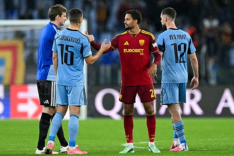 AS Roma's Dutch defender #02 Devyne Rensch greets Slovan Bratislava's Serbian defender #15 Svetozar Markovic at the end of the UEFA Champions League - 1st round day 3 football match between AS Roma and Slovan Bratislava at the Olympic Stadium in Rome on October 20, 2026.