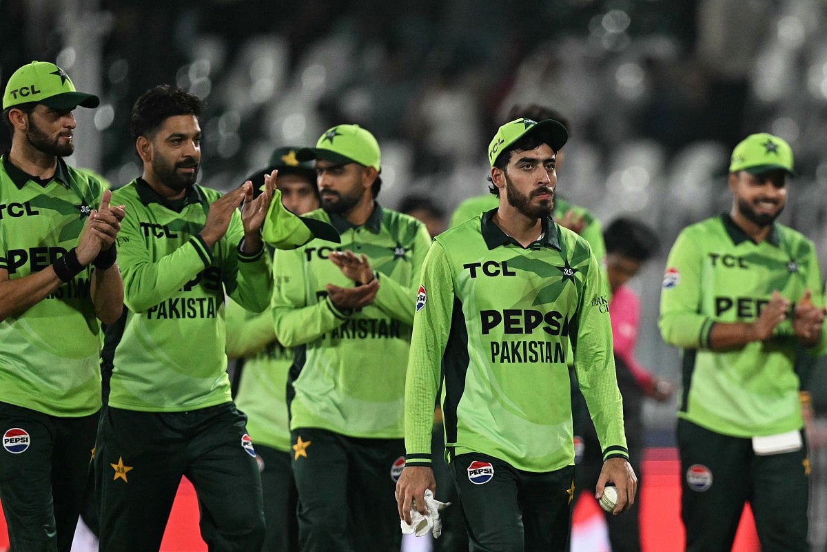 Pakistan's Arafat Minhas (2R) holds the ball after taking his sixth wicket to dismiss England's Adil Rashid as he celebrates with teammates following their victory against England at the end of their one-day international (ODI) tri-series cricket match in the Rawalpindi Cricket Stadium of Rawalpindi on October 20, 2026.