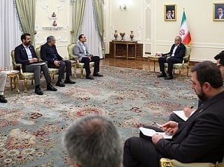 Iran says US must lift threats, sanctions before talks