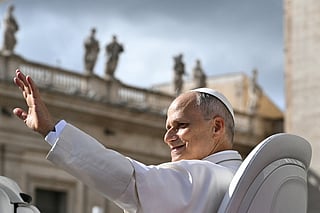 Pope Leo XIV waves to the crowd at the end of the weekly general audience at St Peter's Square in The Vatican on October 21, 2026.