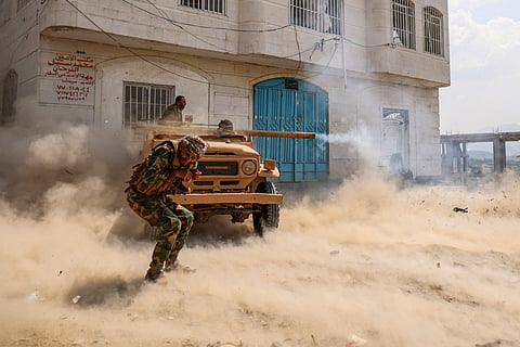 Saudi-backed Yemeni government fighters fire a truck-mounted recoilless rifle during battles against Yemen's Iran-backed Houthis at the Jabal Han front west of the city of Taiz on October 21, 2026.