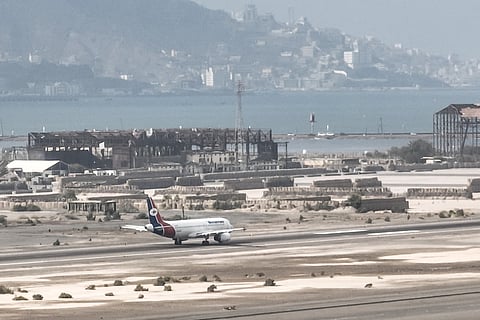 A plane taxis along the runway at Aden Airport on October 21, 2026.