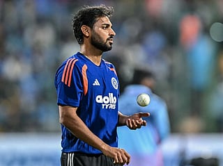 India's Bhuvneshwar Kumar warms up before the start of the fifth T20 international cricket match between India and West Indies at the M Chinnaswamy Stadium in Bengaluru on October 17, 2026.