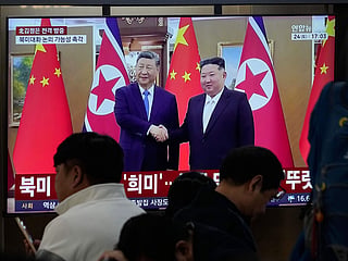 A TV screen shows a file image of North Korean leader Kim Jong Un, right, and Chinese President Xi Jinping during a news program at the Seoul Railway Station in Seoul, South Korea, Saturday, Oct. 24, 2026. 
