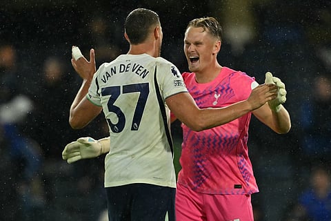 Tottenham Hotspur's Dutch defender #37 Micky van de Ven (L) and Tottenham Hotspur's Czech goalkeeper #31 Antonin Kinsky (R) celebrate on the pitch after the English Premier League football match between Chelsea and Tottenham Hotspur at Stamford Bridge in London on October 24, 2026.