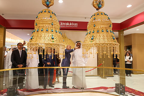 The net gold weight of the combined pair of the 22-carat gold earrings is 16.514kg, more than five times the previous world record