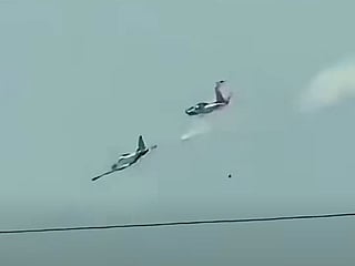 Both planes went down within air base perimeter; no other casualties reported.