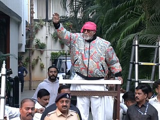 Amitabh Bachchan greets fans outside Jalsa amid heavy security along with Abhishek Bachchan.