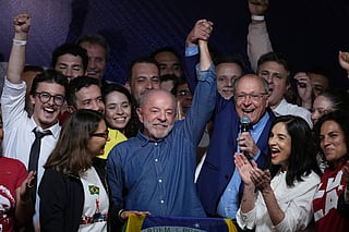 President Luiz Inacio Lula da Silva celebrates with his running mate Geraldo Alckmin after winning a fourth term in the presidential runoff in , Brazil, Sunday, Oct. 25, 2026.