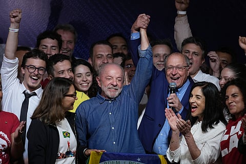 President Luiz Inacio Lula da Silva celebrates with his running mate Geraldo Alckmin after winning a fourth term in the presidential runoff in , Brazil, Sunday, Oct. 25, 2026.