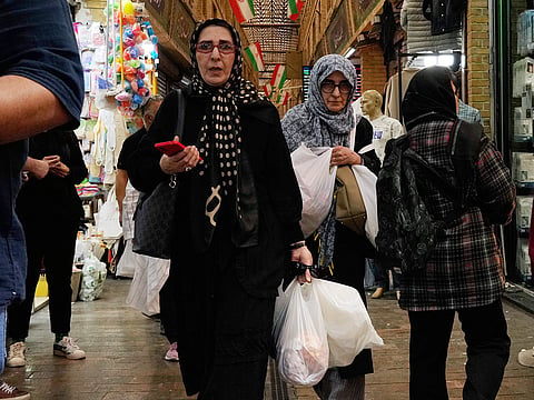 People walk at Tajrish traditional bazaar in Tehran, Iran, Thursday, October 22, 2026.