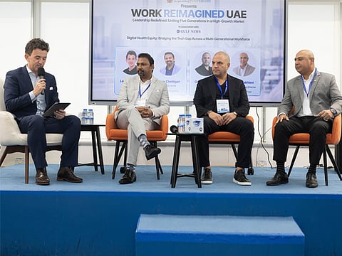 Kiran Chettigari, Director of HR, Zulekha Hospital; George Hojeige, Group CEO, Virtuzone; and Ameet Lakhiani, Group Managing Director, Alfred Holdings, speaking at a panel at Leadership Redefined. The event was moderated by Lakhlan Kitchen