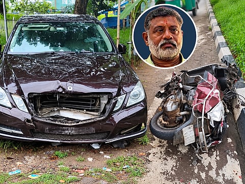 A damaged Mercedes-Benz and a scooter involved in a fatal accident in Cheranelloor, near Kochi, Kerala. The crash, allegedly involving a car driven by a 17-year-old boy, claimed the life of scooter rider Jayabalakrishnan, 55. Police have registered a case against the boy’s father, an Additional District Judge who owns the car, and are preparing to seek cancellation of the teenager’s bail.