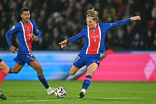 PSG's Mika Godts scores his side's second goal during the French League One soccer match between Paris Saint-Germain and Lyon in Paris, Monday, Oct. 26, 2026.