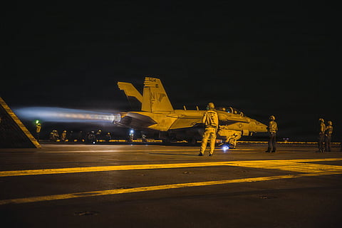 An An EA-18G Growler takes off from the flight deck of USS George Washington (CVN 73). The aircraft carrier is supporting missions including enforcement of US naval blockade against Iranian ports and coastal areas.