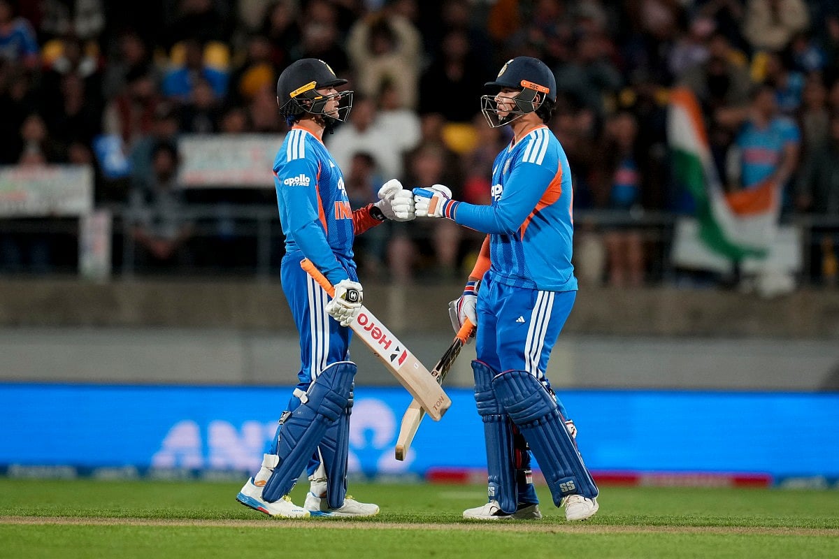 India's Abhishek Sharma (L) bumps gloves with teammate Vaibhav Sooryavanshi during the 3rd T20 cricket match between New Zealand and India at the HNRY Stadium in Wellington on October 27, 2026.