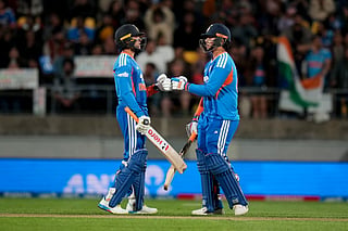 India's Abhishek Sharma (L) bumps gloves with teammate Vaibhav Sooryavanshi during the 3rd T20 cricket match between New Zealand and India at the HNRY Stadium in Wellington on October 27, 2026.