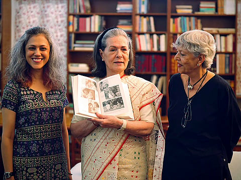 Congress chairperson Sonia Gandhi poses for a group picture with her upcoming book, ‘Belonging: A Journey of Love’, on Thursday. 