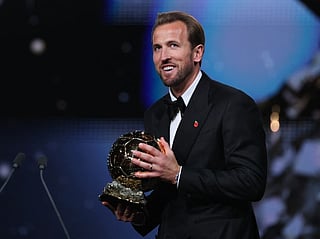 England and Bayern Munich forward Harry Kane smiles after receiving the Ballon d'Or award for the best male footballer during the 2026 Ballon d'Or.