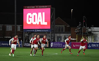 Fleetwood players celebrate after Fleetwood Town's Northern Irish defender #16 Conor Haughey (unseen) scored the winning penalty during a penalty shoot out following a 1-1 draw in the English League Cup fourth round football match between Fleetwood Town and Arsenal at Highbury Stadium in Fleetwood, north west England, on October 27, 2026.