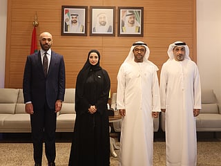 Abdulla AlDhaheri and Mohammad AlQemzi alongside officials during a meeting highlighting diplomatic cooperation and bilateral relations.