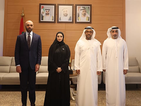 Abdulla AlDhaheri and Mohammad AlQemzi alongside officials during a meeting highlighting diplomatic cooperation and bilateral relations.