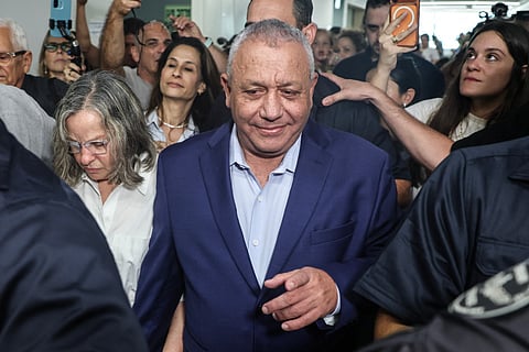 Yashar party leader Gadi Eisenkot and his wife Hannah leave the polling station after voting in Herzliya on October 27, 2026, on the day of Israel's legislative election.