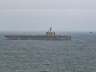 An F-35C Lightning II lands on the flight deck of USS George Washington (CVN 73) as the aircraft carrier continues operations in the Arabian Sea.