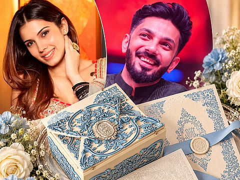 Anirudh Ravichander and Kavya Maran’s wedding reception invitation features intricate powder-blue and ivory detailing, with an ornate keepsake box and vintage-inspired stationery.