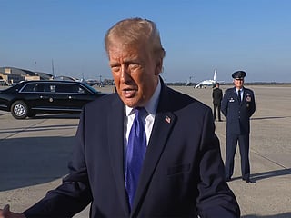 US President Donald Trump speaks with the media as he arrives at Joint Base Andrews, Maryland, US. 