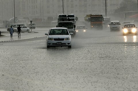 Motorists brave the rain on Sharjah's roads on Monday morning. 

