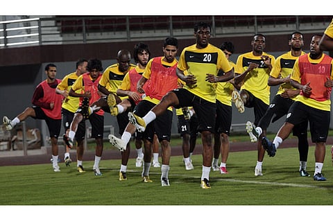 Al Wahda football team players train at their stadium in Abu Dhabi.
