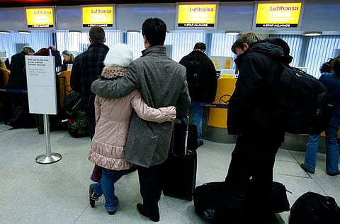 Passengers queue up in Berlin's Tegel Airport after their Lufthansa flights were cancelled.