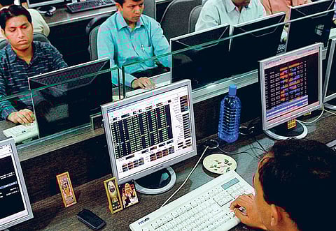 Brokers busy at a firm in Mumbai. Amid raging doubts on how soon India’s economy would stage a comeback, the news of vaccines and hints of slightly better economic data were improving an earlier grim outlook for the country, while markets were seen sustaining its current rebound.