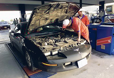 A car workshop mechanic checks a car in Dubai. Vehicles should be maintained at trustworthy agencies and body shops to avoid sudden breakdowns or even fires, police said.
