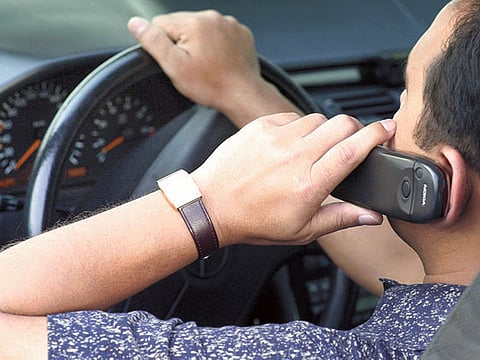 Police seek stringent fine for drivers using mobile phones