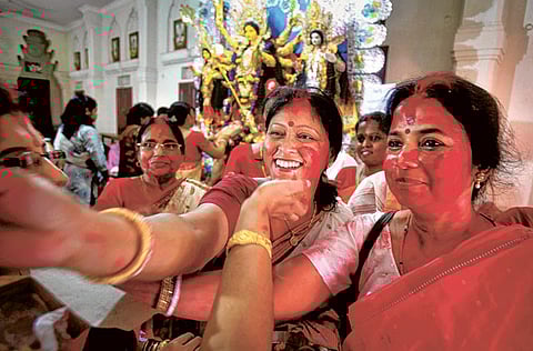 Durga Puja commemorates the slaying of a demon king by lion-riding, ten-armed female deity Durga