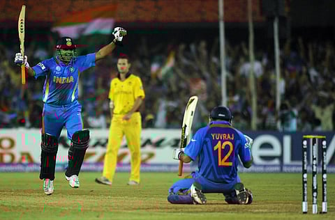 Indian batsmen Suresh Raina (L) and Yuvraj Singh celebrate after winning a match in 2011