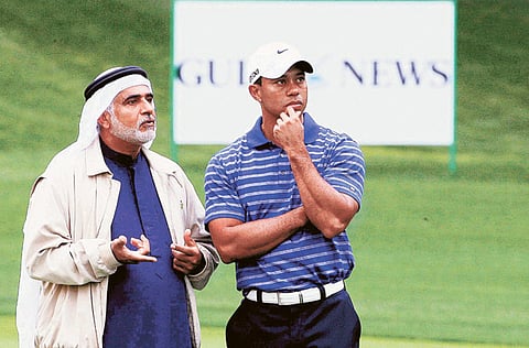 Ismail Sharif with Tiger Woods during the 2011 Dubai Desert Classic Pro-Am at the Emirates Golf Club.  