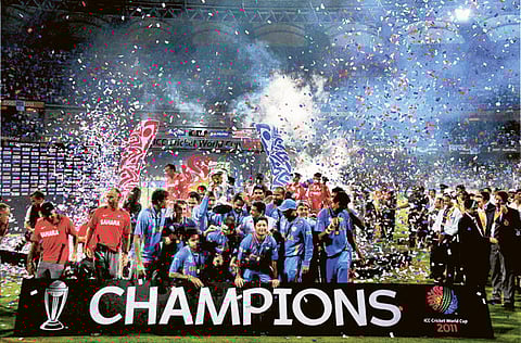 File photo: Indian cricket players jubilate with the trophy after winning the 2011 Cricket World Cup in Mumbai. 