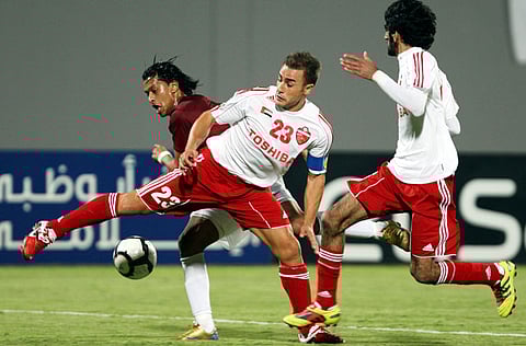 Fabio Cannavaro (23) tries to control the ball during an Al Ahli-Al Wahda match at Al Nahyan Stadium