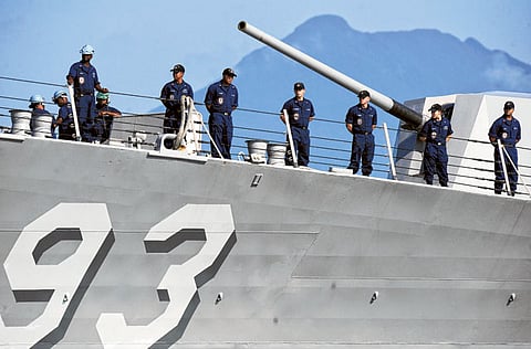 US navy personnel stand in formation on board the USS Chung Hoon ahead of the US-Philippine joint naval military exercise near the disputed Spratly islands on Tuesday. The naval exercises will help the long-time allies deepen their defence ties amid tensions with China over a maritime dispute. 